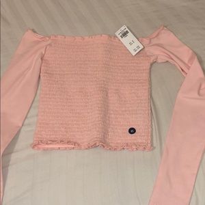 A pink Hollister long sleeve off the shoulder top
